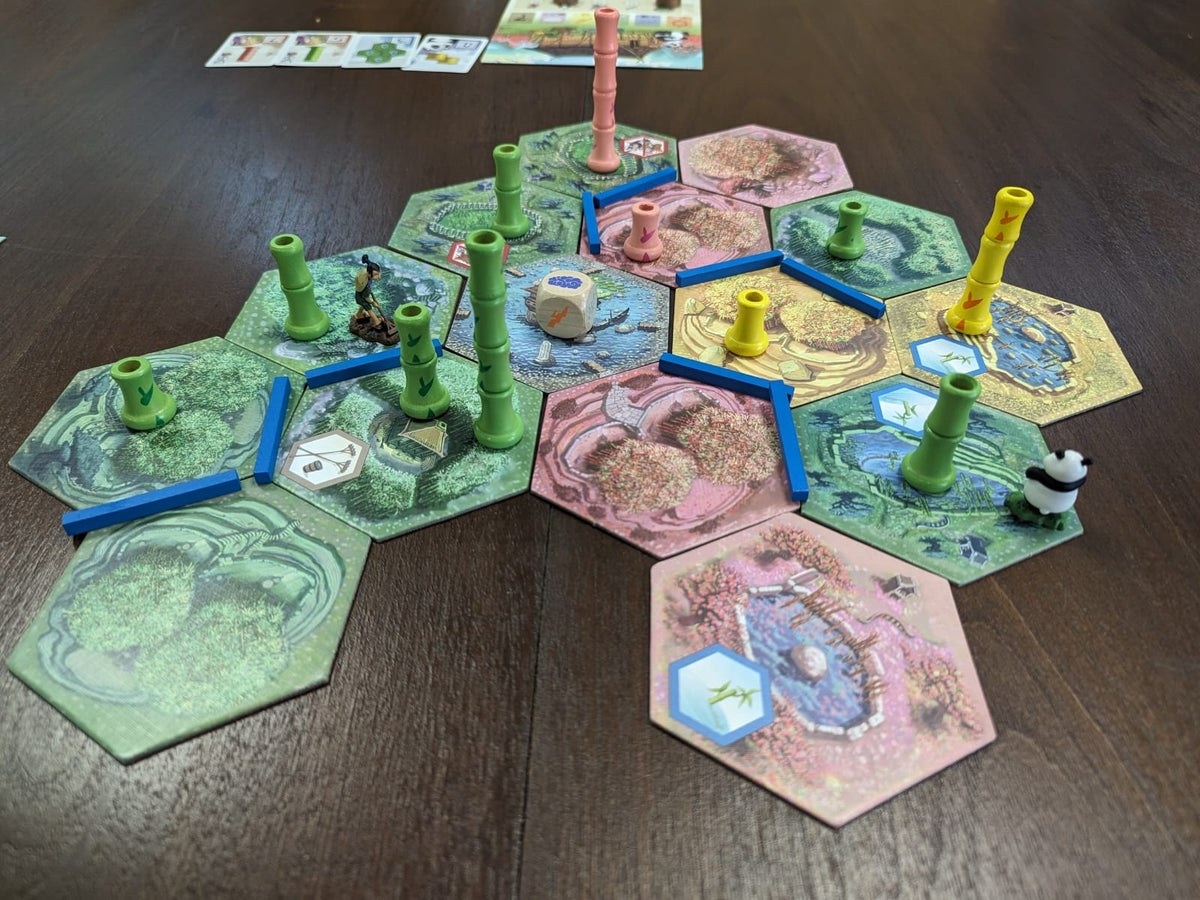 A colourful tile laying board game mid play